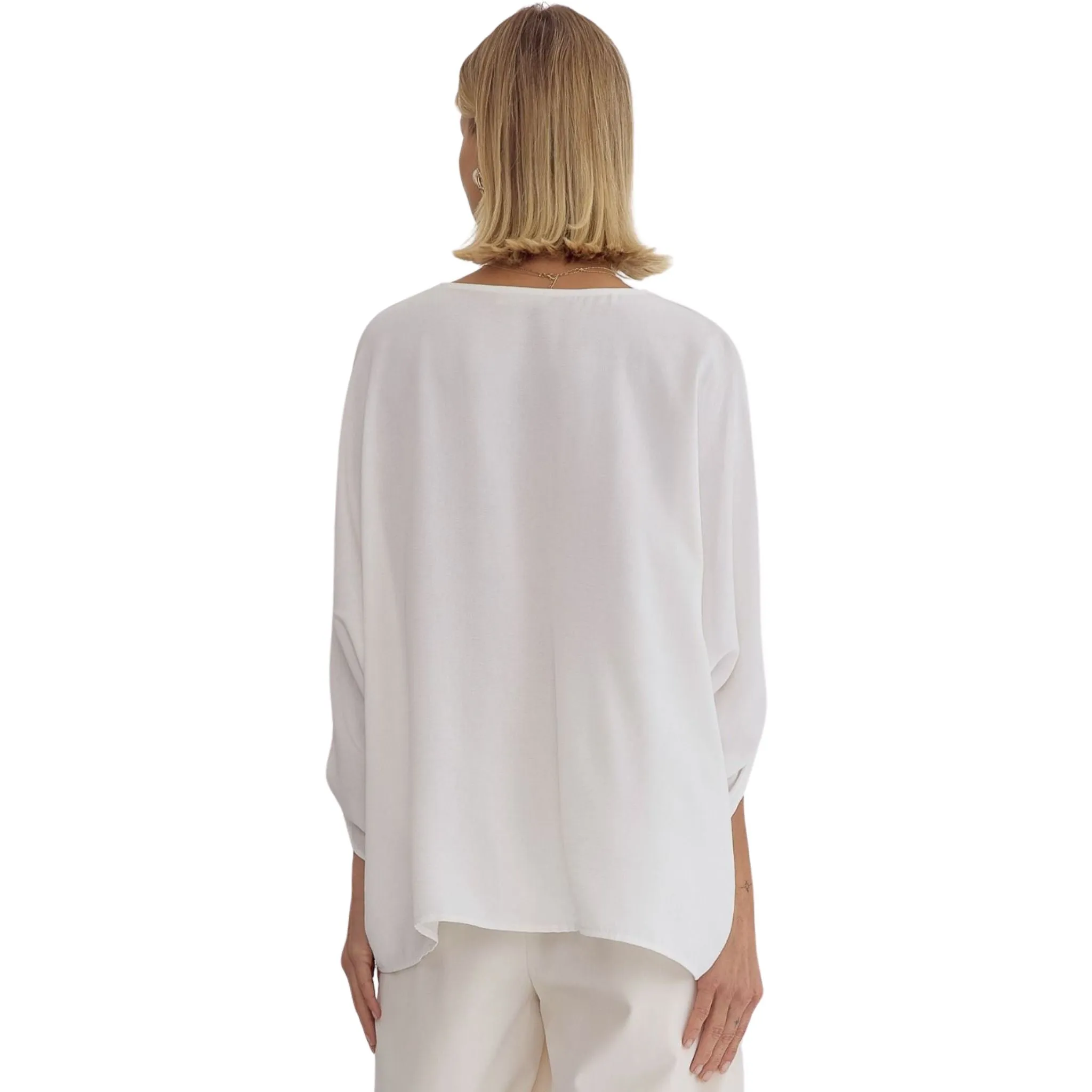 Off White V-neck 1/2 Sleeve Top Featuring Button Detailing at Sleeves.