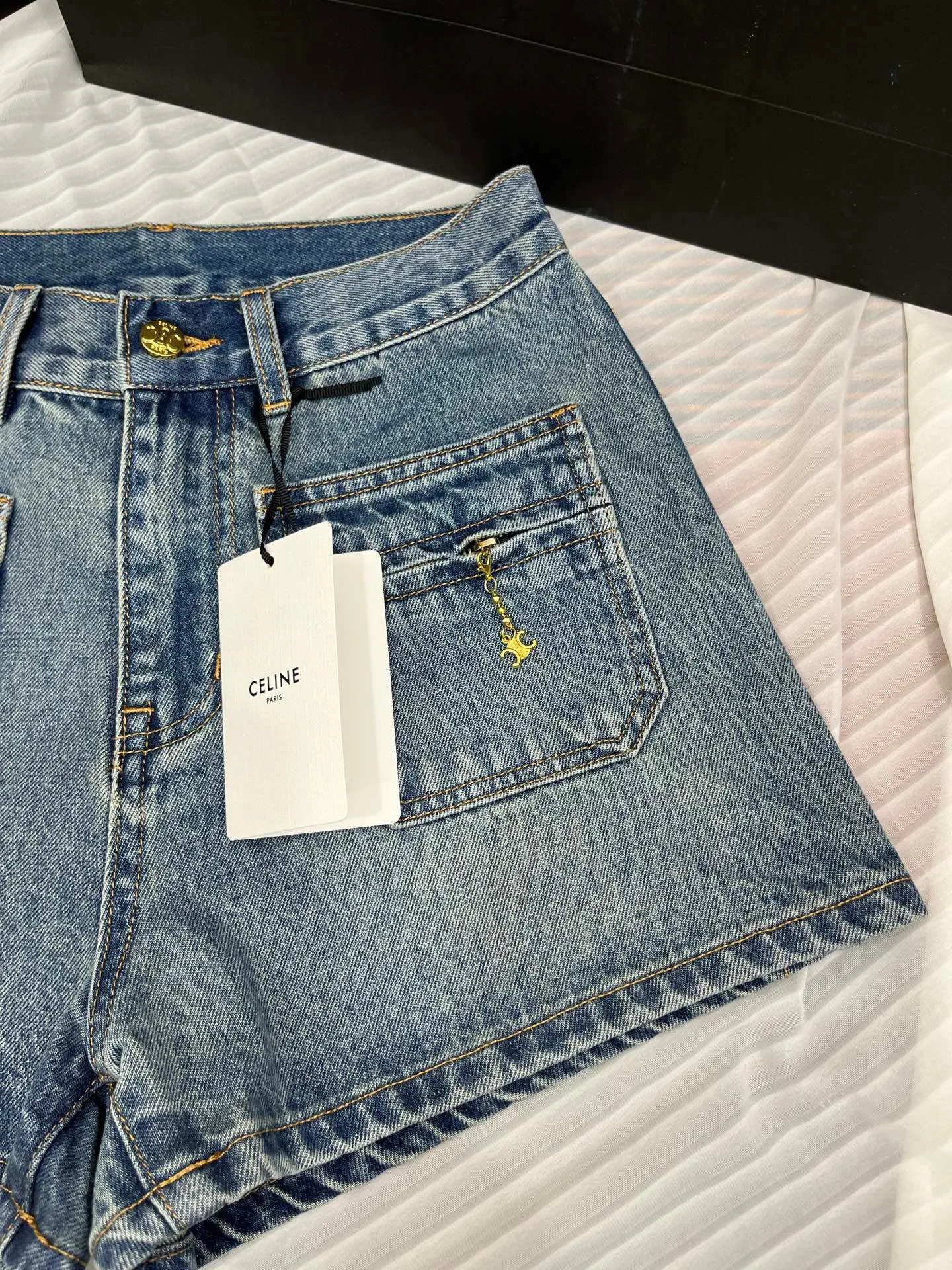 Washed mid-rise denim shorts